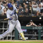 
              Kansas City Royals' Salvador Perez swings into a home run off Chicago White Sox starting pitcher Michael Kopech during the fourth inning of a baseball game Monday, Aug. 1, 2022, in Chicago. (AP Photo/Charles Rex Arbogast)
            