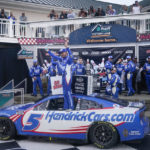 
              Kyle Larson, center, celebrates after winning a NASCAR Cup Series auto race in Watkins Glen, N.Y., Sunday, Aug. 21, 2022. (AP Photo/Seth Wenig)
            