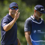 
              Adam Scott, of Australia, waves to the gallery after putting on the fourth green during the second round of the BMW Championship golf tournament at Wilmington Country Club, Friday, Aug. 19, 2022, in Wilmington, Del. (AP Photo/Nick Wass)
            