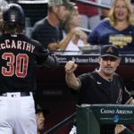 
              Arizona Diamondbacks' Jake McCarthy (30) celebrates his home run against the Philadelphia Phillies with manager Torey Lovullo, right, during the fourth inning of a baseball game Wednesday, Aug. 31, 2022, in Phoenix. (AP Photo/Ross D. Franklin)
            