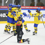 
              Hanna Olsson of Sweden scores to 2-0 in the IIHF World Championship Woman's ice hockey match between Sweden and Germany in Frederikshavn, Denmark, Saturday, Aug. 27, 2022. (Henning Bagger/Ritzau Scanpix via AP)
            