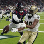 
              Houston Texans cornerback Tremon Smith (1) breaks up a pass intended for New Orleans Saints wide receiver Tre'Quan Smith (10) during the first half of an NFL preseason football game Saturday, Aug. 13, 2022, in Houston. (AP Photo/David J. Phillip)
            