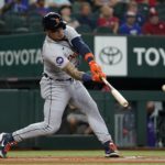 
              Detroit Tigers' Javier Baez connects for a RBI single that scored Victor Reyes in the first inning of a baseball game against the Texas Rangers in Arlington, Texas, Saturday, Aug. 27, 2022. (AP Photo/Tony Gutierrez)
            