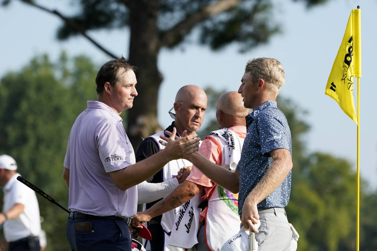 Will Zalatoris, right, greets Sepp Straka, of Austria, after defeating Straka in a playoff in the f...