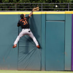 
              Baltimore Orioles center fielder Cedric Mullins can't catch a home run hit by Cleveland Guardians' Josh Naylor during the fourth inning of a baseball game Tuesday, Aug. 30, 2022, in Cleveland. (AP Photo/Ron Schwane)
            