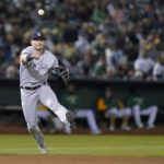 
              New York Yankees third baseman Josh Donaldson throws to first for an out against Oakland Athletics' Chad Pinder during the ninth inning of a baseball game in Oakland, Calif., Saturday, Aug. 27, 2022. (AP Photo/Godofredo A. Vásquez)
            