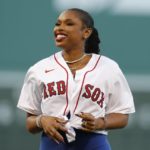 
              Jennifer Hudson smiles after throwing out the ceremonial first pitch before a baseball game between the Boston Red Sox and the New York Yankees, Friday, Aug. 12, 2022, in Boston. (AP Photo/Michael Dwyer)
            