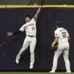 
              Milwaukee Brewers' Tyrone Taylor makes a catch at the wall on a ball hit by Tampa Bay Rays' David Peralta during the second inning of a baseball game Tuesday, Aug. 9, 2022, in Milwaukee. (AP Photo/Morry Gash)
            