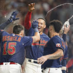 
              Minnesota Twins' Gio Urshela (15) celebrates with teammates after hitting a walkoff two-run home run during the bottom of 10th inning of a baseball game against the Detroit Tigers in Minneapolis, Monday, Aug. 1, 2022. (AP Photo/Abbie Parr)
            