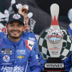 
              Kyle Larson smiles with his trophy after winning a NASCAR Cup Series auto race in Watkins Glen, N.Y., Sunday, Aug. 21, 2022. (AP Photo/Seth Wenig)
            