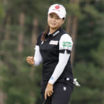 
              Hye-Jin Choi, from South Korea, pumps her fist after making an eagle on the ninth hole during the second round of the CP Women's Open golf tournament Friday, Aug. 26, 2022, in Ottawa, Ontario. (Adrian Wyld/The Canadian Press via AP)
            