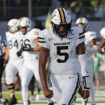 
              Vanderbilt quarterback Mike Wright (5) reacts after making a touchdown against Hawaii during the first half of an NCAA college football game, Saturday, Aug. 27, 2022, in Honolulu. (AP Photo/Marco Garcia)
            