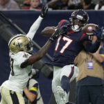
              Houston Texans wide receiver Jalen Camp (17) makes a touchdown catch in front of New Orleans Saints cornerback DaMarcus Fields (39) during the first half of an NFL preseason football game Saturday, Aug. 13, 2022, in Houston. (AP Photo/David J. Phillip)
            