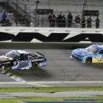 
              Jeremy Clements (51) crosses the finish line in front of Timmy Hill (13) to win a NASCAR Xfinity Series auto race at Daytona International Speedway, Saturday, Aug. 27, 2022, in Daytona Beach, Fla. (AP Photo/Terry Renna)
            