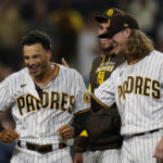 
              San Diego Padres' Trent Grisham, left, celebrates with teammate Josh Hader after hitting a walk-off home run during the ninth inning of the second baseball game of a doubleheader against the Colorado Rockies, Tuesday, Aug. 2, 2022, in San Diego. (AP Photo/Gregory Bull)
            