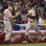 
              San Diego Padres' Trent Grisham, right, celebrates his three-run home run with third base coach Matt Williams (18) during the fifth inning of the team's baseball game against the Washington Nationals, Friday, Aug. 12, 2022, in Washington. (AP Photo/Nick Wass)
            