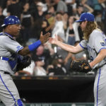 
              Kansas City Royals catcher Salvador Perez and relief pitcher Scott Barlow celebrate the team's 2-1 win over the Chicago White Sox after a baseball game Monday, Aug. 1, 2022, in Chicago. (AP Photo/Charles Rex Arbogast)
            