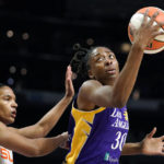 
              Los Angeles Sparks forward Nneka Ogwumike, right, tries to shoot as Connecticut Sun forward Alyssa Thomas defends during the first half of a WNBA basketball game Thursday, Aug. 11, 2022, in Los Angeles. (AP Photo/Mark J. Terrill)
            