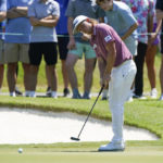 
              Cameron Smith, of Australia, watches his putt on the fifth green during the final round of the St. Jude Championship golf tournament, Sunday, Aug. 14, 2022, in Memphis, Tenn. (AP Photo/Mark Humphrey)
            