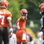 
              Cleveland Browns quarterback Deshaun Watson, center, takes part in drills during the NFL football team's training camp, Monday, Aug. 1, 2022, in Berea, Ohio. (AP Photo/Nick Cammett)
            