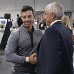 
              Rory McIlroy, of Northern Ireland, left, shakes hands with PGA Tour Commissioner Jay Monahan after a press conference at East Lake Golf Club prior to the start of the Tour Championship golf tournament Wednesday Aug 24, 2022, in Atlanta, Ga. (AP Photo/Steve Helber)
            