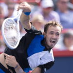 
              Daniil Medvedev serves to Nick Kyrgios of Australia during second round play at the National Bank Open tennis tournament Wednesday Aug. 10, 2022. in Montreal. (Paul Chiasson/The Canadian Press via AP)
            