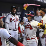 
              Atlanta Braves' William Contreras swings the pink sword in the dugout after his home run against the New York Mets during the second inning of a baseball game Monday, Aug. 15, 2022, in Atlanta. (Curtis Compton/Atlanta Journal-Constitution via AP)
            