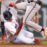 
              Boston Red Sox's Reese McGuire, left, collides with Atlanta Braves second baseman Vaughn Grissom while being forced out during the second inning of a baseball game Wednesday, Aug. 10, 2022, in Boston. (AP Photo/Charles Krupa)
            