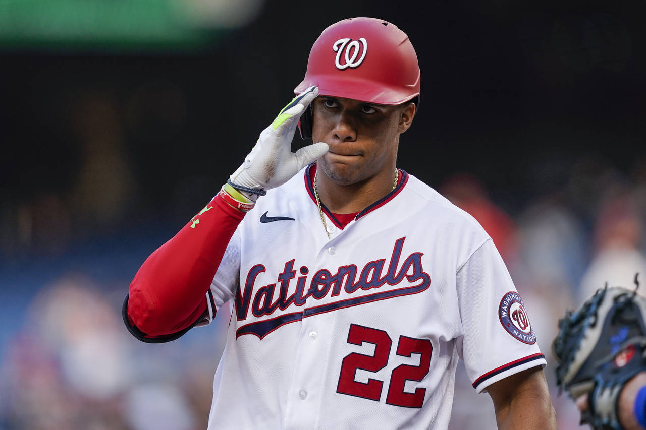 Washington Nationals' Juan Soto acknowledges the New York Mets dugout as he steps in the batter's b...