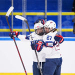 
              Caroline Harvey and Taylor Heise of USA celebrate during the IIHF World Championship Women's ice hockey match between Japan and USA in Herning, Denmark, Thursday, Aug. 25, 2022. (Bo Amstrup/Ritzau Scanpix via AP)
            