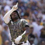 
              San Diego Padres' Josh Bell reacts after hitting a two-run home run during the sixth inning of a baseball game against the Washington Nationals, Sunday, Aug. 21, 2022, in San Diego. (AP Photo/Gregory Bull)
            