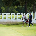 
              Adam Scott, of Australia, right, walks along the 13th fairway with his caddie during the first round of the St. Jude Championship golf tournament Thursday, Aug. 11, 2022, in Memphis, Tenn. (AP Photo/Mark Humphrey)
            