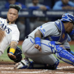 
              Tampa Bay Rays' Harold Ramirez, left, scores around the tag by Kansas City Royals catcher Salvador Perez on a two-run single by Randy Arozarena during the sixth inning of a baseball game Friday, Aug. 19, 2022, in St. Petersburg, Fla. (AP Photo/Chris O'Meara)
            