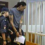
              WNBA star and two-time Olympic gold medalist Brittney Griner, right, enters a cage in a courtroom prior to a hearing in Khimki just outside Moscow, Russia, Thursday, Aug. 4, 2022. Closing arguments in Brittney Griner's cannabis possession case are set for Thursday, nearly six months after the American basketball star was arrested at a Moscow airport in a case that reached the highest levels of US-Russia diplomacy. (Evgenia Novozhenina/Pool Photo via AP)
            