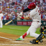 
              Philadelphia Phillies' Bryce Harper hits a two-run single against Pittsburgh Pirates pitcher Bryse Wilson during the first inning of a baseball game, Friday, Aug. 26, 2022, in Philadelphia. (AP Photo/Matt Slocum)
            