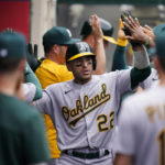 
              Oakland Athletics' Ramon Laureano, center, is congratulated by teammates after hitting a two-run home run during the fourth inning of a baseball game against the Los Angeles Angels, Thursday, Aug. 4, 2022, in Anaheim, Calif. (AP Photo/Jae C. Hong)
            