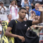 
              Canada's Felix Auger-Aliassime walks off the court after losing to Casper Ruud of Norway for his win in quarterfinal play at the National Bank Open tennis tournament, Friday, Aug. 12, 2022 in Montreal. (Paul Chiasson/The Canadian Press via AP)
            