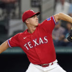 
              Texas Rangers starting pitcher Glenn Otto throws during the first inning of a baseball game against the Detroit Tigers in Arlington, Texas, Friday, Aug. 26, 2022. (AP Photo/LM Otero)
            