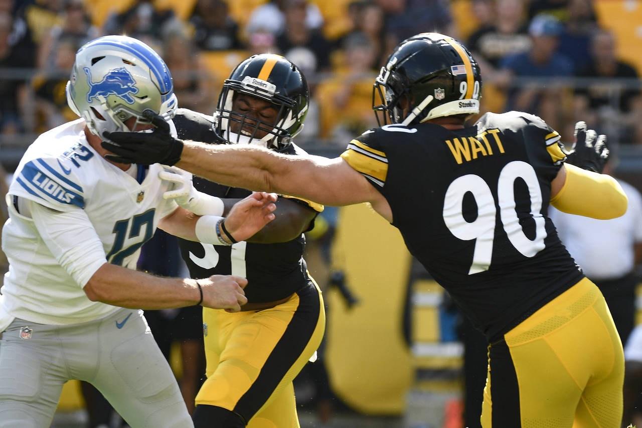 Pittsburgh Steelers linebacker T.J. Watt (90) gets a hand on Detroit Lions quarterback Tim Boyle (1...
