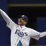 
              Kazuhiro Nakai, Consul-General of Japan in Miami, reacts to throwing out the ceremonial first pitch before the Tampa Bay Rays played the Los Angeles Angels in a baseball game Thursday, Aug. 25, 2022, in St. Petersburg, Fla. (AP Photo/Scott Audette)
            