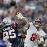 
              New York Giants quarterback Daniel Jones (8 throws a pass over New England Patriots defensive tackle Daniel Ekuale (95) during the first half of a preseason NFL football game Thursday, Aug. 11, 2022, in Foxborough, Mass. (AP Photo/Charles Krupa)
            