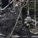 
              EDS NOTE: GRAPHIC CONTENT - A burned out body of Ukrainian military prisoner is seen in destroyed barrack at a prison in Olenivka, in an area controlled by Russian-backed separatist forces, eastern Ukraine, Friday, July 29, 2022. Russia and Ukraine accused each other Friday of shelling the prison in Olenivka in a separatist region of eastern Ukraine, an attack that reportedly killed dozens of Ukrainian military prisoners who were captured after the fall of a southern port city of Mariupol in May. (AP Photo)
            
