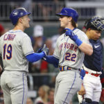 
              New York Mets' Brett Baty, right, is greeted by Mark Canha after his two-run home run against the Atlanta Braves during the second inning of a baseball game Wednesday, Aug. 17, 2022, in Atlanta. (Curtis Compton/Atlanta Journal-Constitution via AP)
            