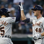 
              Detroit Tigers' Kerry Carpenter (48) celebrates with Tucker Barnhart after hitting a solo home run off Cleveland Guardians relief pitcher Eli Morgan during the sixth inning in the second baseball game of a doubleheader Monday, Aug. 15, 2022, in Cleveland. (AP Photo/Ron Schwane)
            