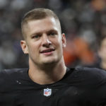 
              FILE - Las Vegas Raiders defensive end Carl Nassib (94) leaves the field after a victory over the Denver Broncos of an NFL football game, Sunday, Dec. 26, 2021, in Las Vegas. The Tampa Bay has signed outside linebacker Carl Nassib, who returns after playing for the Buccaneers in 2018 and 2019. Nassib joined the Buccaneers in Nashville, where they are practicing Wednesday, Aug. 17, 2022, and Thursday ahead of Saturday night's exhibition. (AP Photo/Jeff Bottari, File)
            