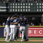 
              Seattle Mariners infielders, including third baseman Eugenio Suarez (28) and second baseman Adam Frazier, second from, right, celebrate after a baseball game against the Cleveland Guardians, Thursday, Aug. 25, 2022, in Seattle. (AP Photo/Stephen Brashear)
            