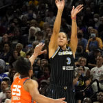 
              Chicago Sky's Candace Parker shoots over Connecticut Sun's Alyssa Thomas during the second half in Game 1 of a WNBA basketball semifinal playoff series Sunday, Aug. 28, 2022, in Chicago. The Sun won 68-63. (AP Photo/Charles Rex Arbogast)
            