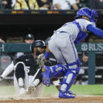 
              Kansas City Royals' MJ Melendez, right, tags out Chicago White Sox's Josh Harrison during the seventh inning of a baseball game Wednesday, Aug. 31, 2022, in Chicago. (AP Photo/Kamil Krzaczynski)
            