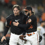 
              Baltimore Orioles pitcher Clonel Perez, right, and catcher Adley Rutschman celebrate after the top of the eighth inning of a baseball game against the Pittsburgh Pirates, Friday, Aug. 5, 2022, in Baltimore. The Orioles won 1-0. (AP Photo/Gail Burton)
            