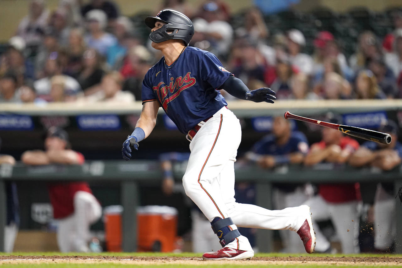 Minnesota Twins' Gio Urshela watches his walkoff two-run home run during the bottom of the tenth in...